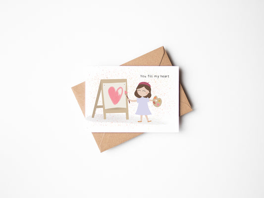 This beautifully illustrated card featuring a little artist girl drawing and coloring a big pink heart is perfect for lots of occasions &nbsp;- anniversaries, thank you's, or just to say your loved one - You fill my heart!