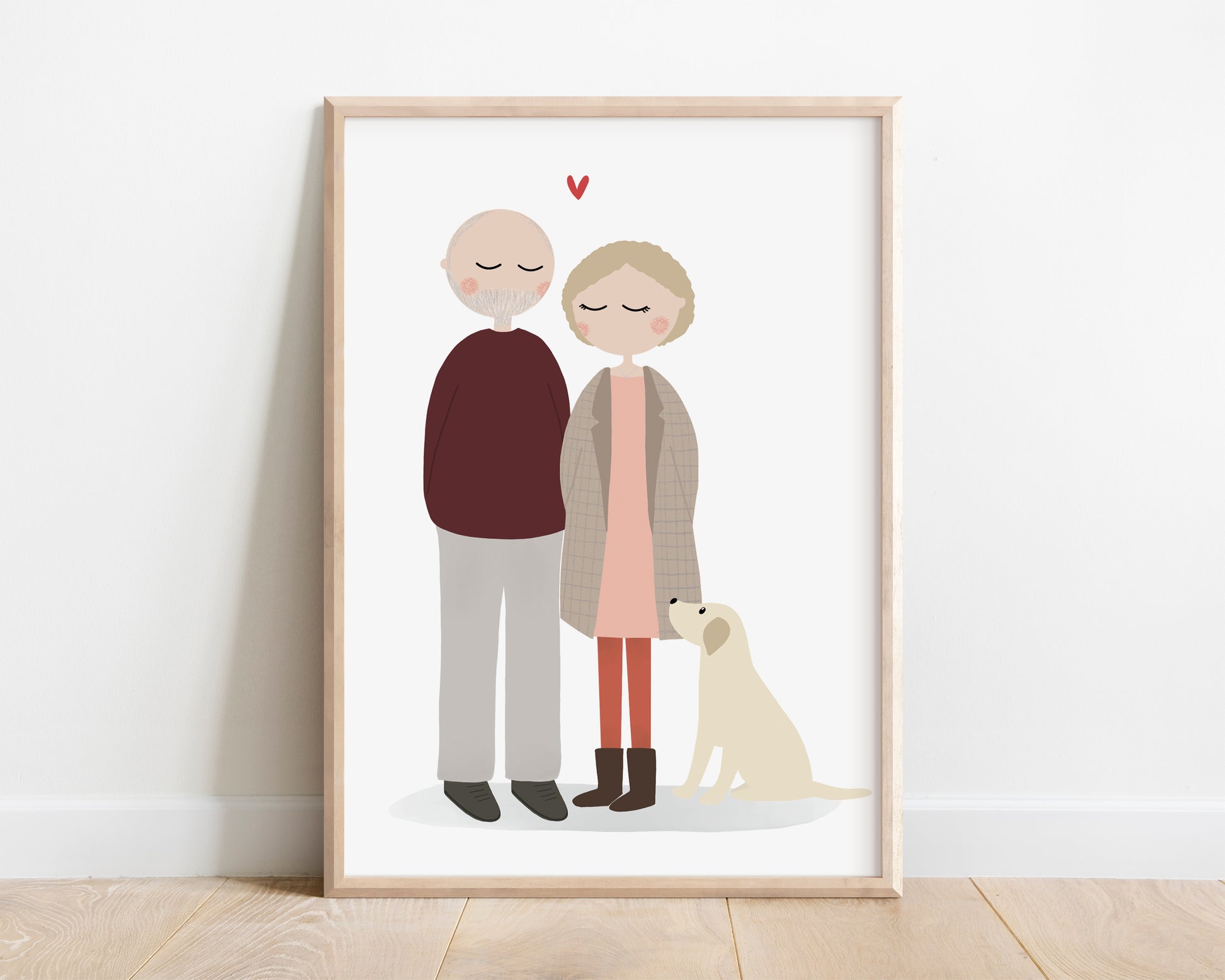 A portrait of a couple and their labrador